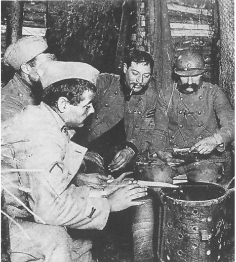 Some poilus gather around a brazier for warmth in a dugout.