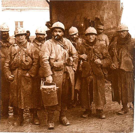 These exhausted men from the 165th RI are only too ready to leave the front.