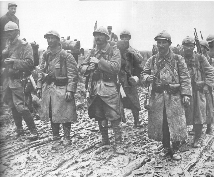 Note the man carrying  a bugle on his pack. The man to his right wears a German canteen, while the man behind carries a signalling lamp.