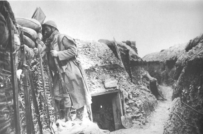 A look-out observes the enemy line via an armored trench shield.