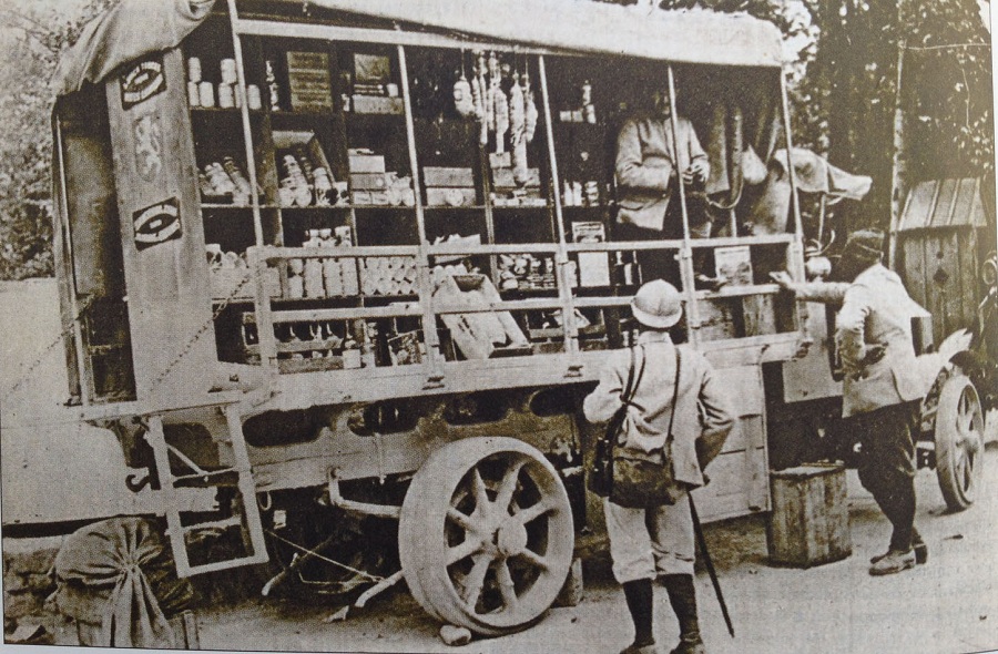 A truck-bazar offers small provisions for sale to troops in the support lines. 