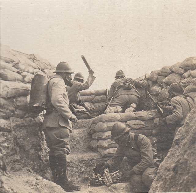 A posed shot with grenades and flame-thrower. 