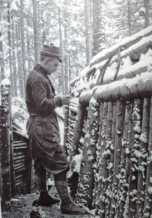 A soldier reads a letter, in a strongly revetted support trench in the mountainous Vosges region. Photo taken by Frantz Adam, 1915.