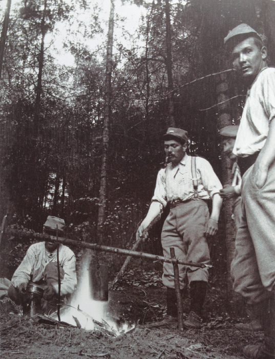 Soldiers cook up a meal over an open fire in a rear-area sector.  Photo taken by Frantz Adam, April 1915.