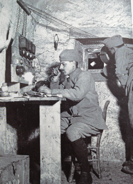 A telephonist and optics signaller in a command post at La Forain. Photo taken by Loys Roux, May 1916.