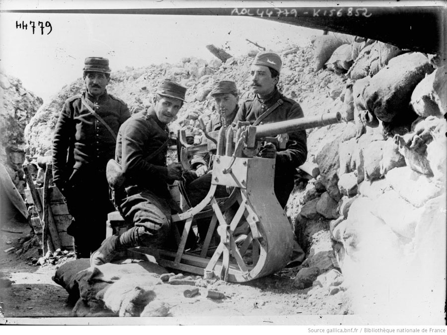 A gun crew stands by their revolver-canon on the summit of Vauquois, early 1915.