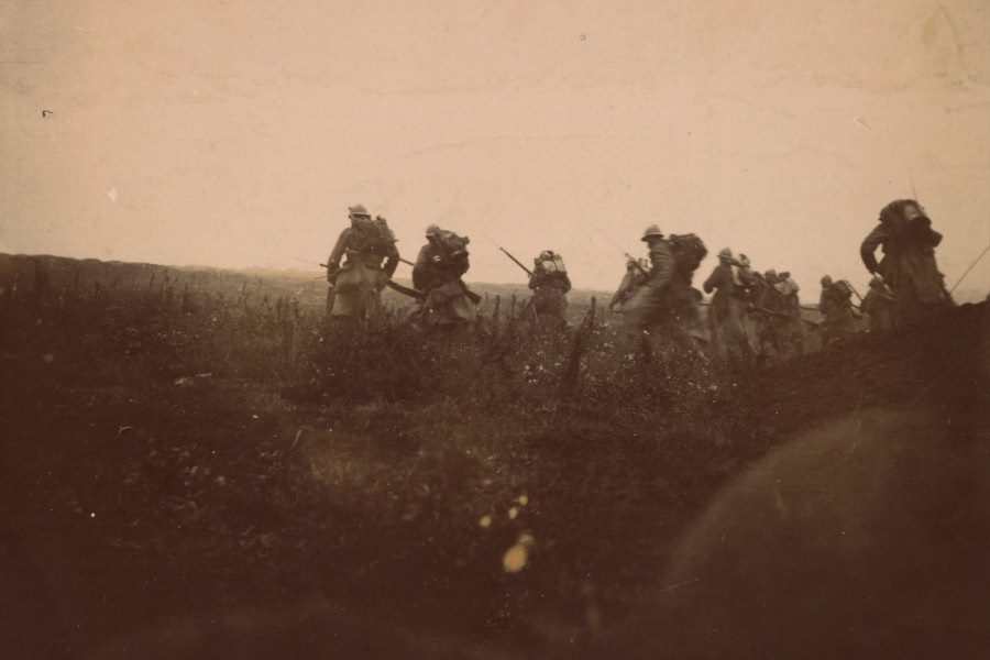 An actual combat photograph of troops going into the attack in Champagne, fall 1915.