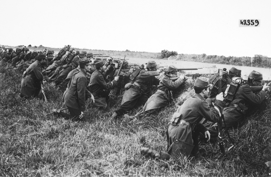 French soldiers take cover in roadside ditch in 1914.