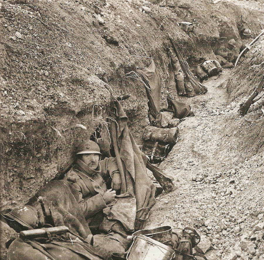 A poilu sits in his trench abode.