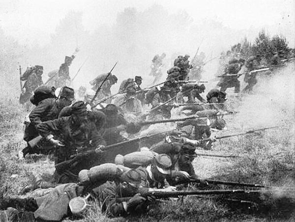 An intense (though perhaps staged) photo of a French company advancing. An accurate depiction of 1914 fighting.