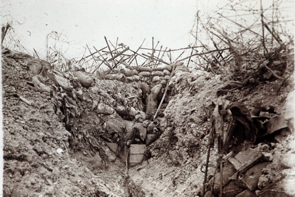 A bramble of wire-entanglements protect this shabby trench.