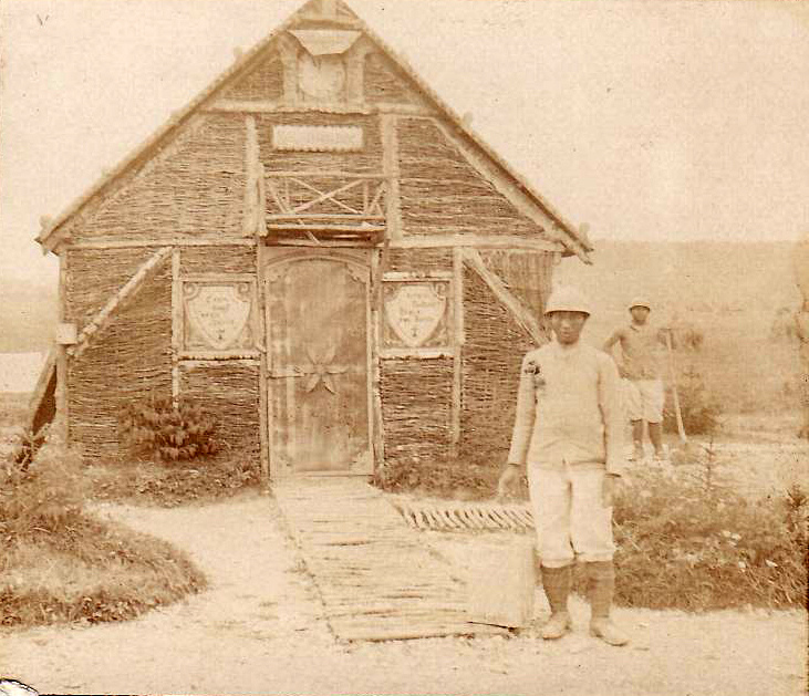 French Annamites (Indonesian troops) stand beside a well built guitoune. 