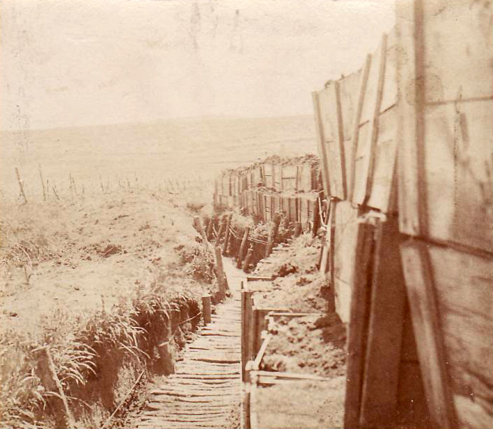 An above ground trench made from earth-filled crates.