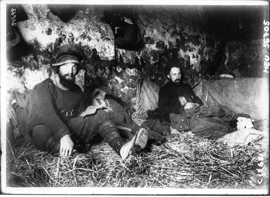 A rare example of a photo taken in an underground French dugout shows the primitive conditions to be found in the average front line shelter. Winter 1914-15.