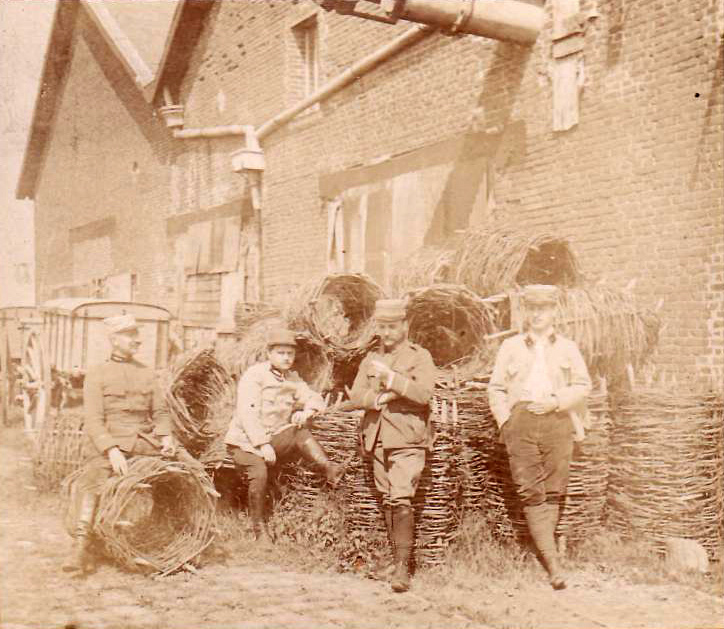 French officers repose beside stacks of gabions