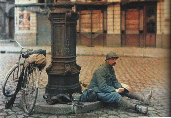 A bicyclist sits for a little rest.