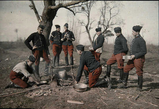 Pre-war photo of calvary troopers preparing a meal.