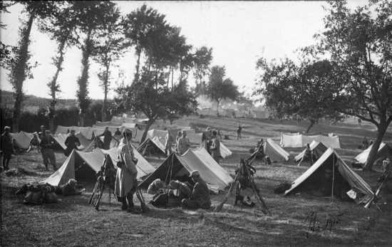 Soldiers wait to go on duty in their camp.