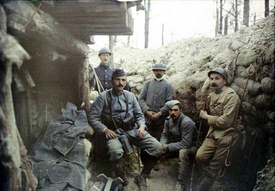 Soldiers and officers sitting outside a shelter, 1915.