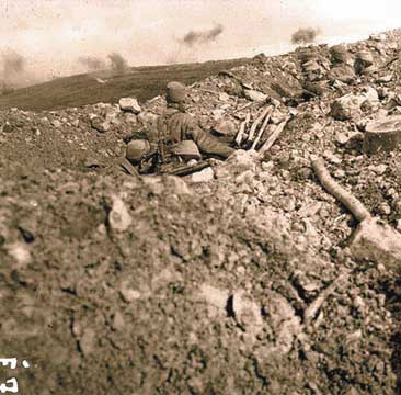 Some soldiers look on as another part of the line is shelled, Les Éparges, 1915.