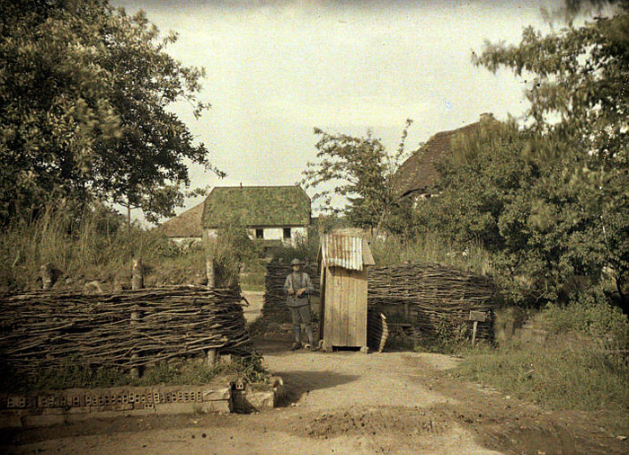 A lone guard stands beside his post.