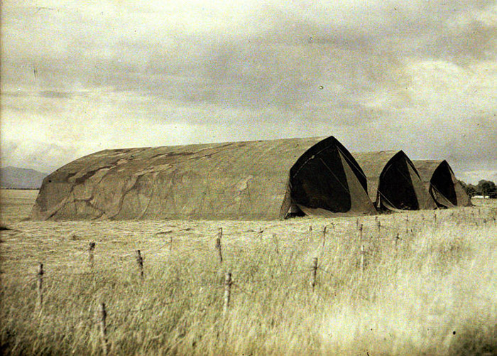 Camouflaged aireplane hangars.