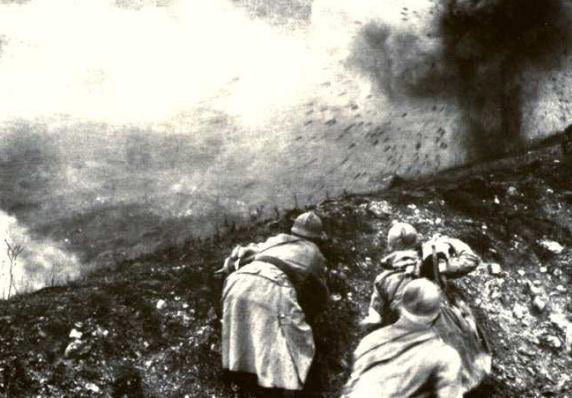 Soldiers duck as a shell impacts on the other side of an embankment, Verdun, 1916. (Note: this was actually from a filming done in the 1920s)