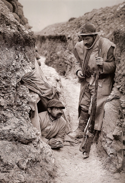 A man emerges from the entrance to a listening post, Nieuport 1915.