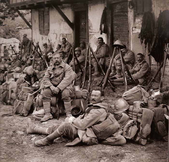 A unit of older reservists or territorials takes a short rest during a march, 1916.
