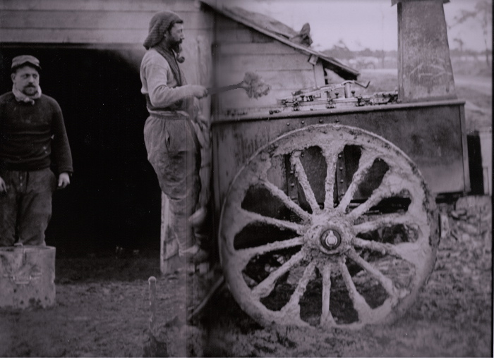 A cook mounted on his field kitchen prepares a meal.