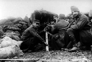 A crew operates a 37 mm gun.