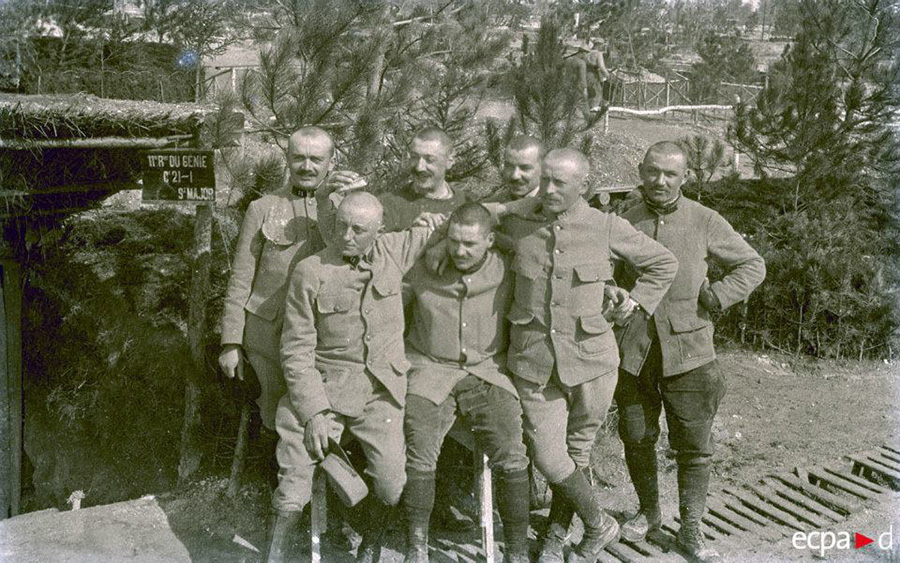 A group of engineers show off their new haircuts.