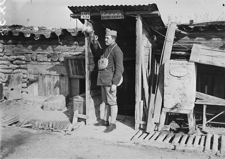 A man stands at the ready next to a gas alarm.