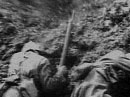 Soldiers take cover from an exploding shell.