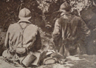 Two soldiers sitting in an advanced post in July 1918, after the war returned to movement. Note the ARS-17 gas masks. 