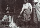 Soldiers cook up a meal over an open fire in a rear-area sector.  Photo taken by Frantz Adam, April 1915.