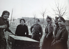 A group of Russian soldiers of the Russian Legion bargain over prices with two French ladies. Photo taken by Frantz Adam, near Viller-Franqueux, March 1917.