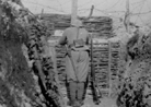 Barbed-wire can be seen stretched across a trench to defend against infiltrators.