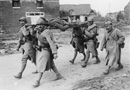 French stretcher-bearers transporting a wounded British soldier, March 1918.