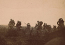 An actual combat photograph of troops going into the attack in Champagne, fall 1915.