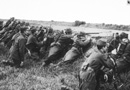 French soldiers take cover in roadside ditch in 1914.