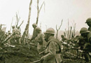 Troops advance over shelled ground during the Chemin-des-Dames offensive.