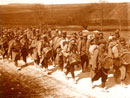 A regimental band marches at the head of a column, 1915.