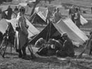 Soldiers wait to go on duty in their camp.