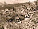 Some soldiers look on as another part of the line is shelled, Les Éparges, 1915.