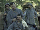 A Colonial soldier gets his haircut by the unit barber.