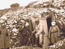 Soldiers don gas masks, Somme, 1915.