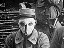 A group of soldiers pose with their gas masks, 1915.