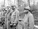 A group of me lined up for mask inspection, 1916.