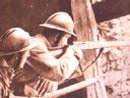 Snipers take up position high up in a ruined building.